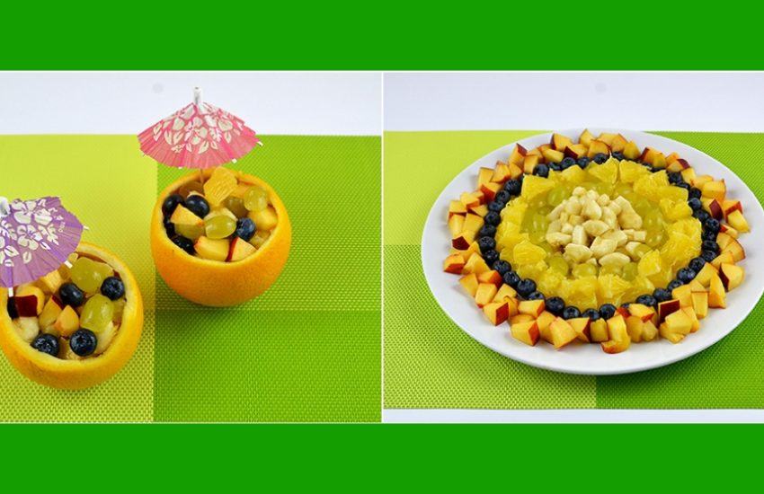 Leckerer Obstsalat mit Bananen, Orange, Trauben, Pfirsich und ...